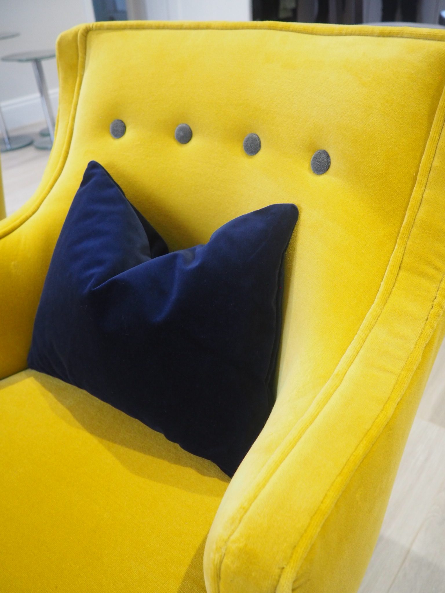 Mustard chair by Atkin and Thyme with a navy velvet cushion